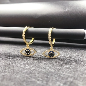 Macro view of 14K gold-plated Evil Eye hoop earrings with sparkling white zircons