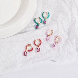 Detail of colorful geometric enamel hoop earrings with vibrant rectangular zircon pendants