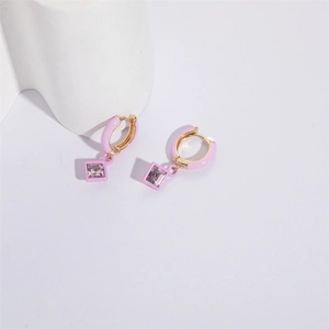 Detailed close-up of pink enamel hoop earrings with purple square zircon crystals