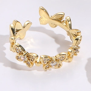 Macro shot of gold butterfly open ring featuring micro-pave cubic zirconia accents