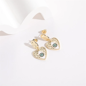 Golden heart evil eye earrings with hammered texture and blue enamel details