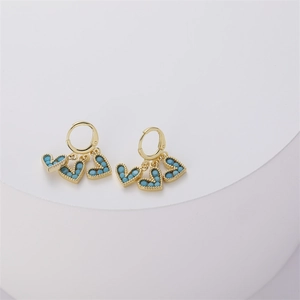 Detail of 14K gold-plated heart-shaped drop earrings with turquoise-colored beads