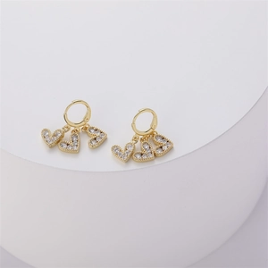 Detail of 14K gold plated heart drop earrings with sparkling white cubic zirconia stones