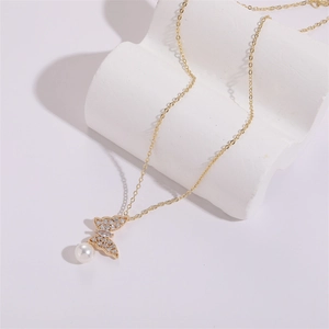 Elegant 14K gold butterfly pendant necklace with zircon wings and white pearl drop