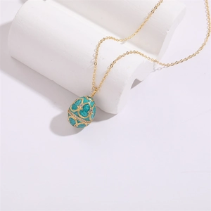 Luxurious enamel Faberge style egg necklace with 14K gold plating and sparkling zircon