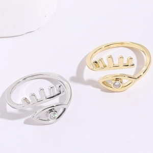 Detail of adjustable evil eye rings with eyelashes and white zircon in gold and silver