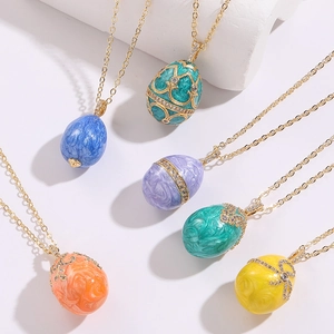 Detail view of colorful enamel Easter egg pendants with 14K gold plating and cubic zirconia