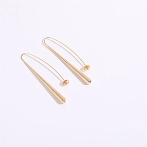 Minimalist long gold metal leaf drop earrings with matte finish and curved hooks