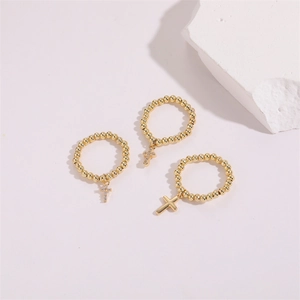 Three-piece set of 14K gold-plated beaded cross rings with sparkling zircon accents