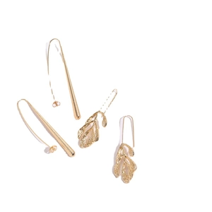 Artistic gold-plated drop earrings featuring frosted cone and textured leaf designs