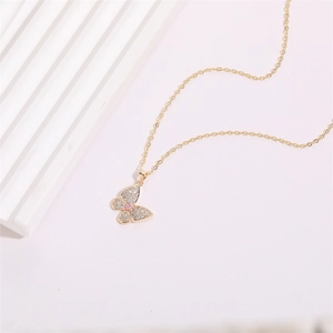 Elegant gold butterfly pendant necklace with sparkling zircons and pink marquise stone