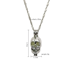 Luminous skull pendant necklace with silver link chain and glowing eyes feature