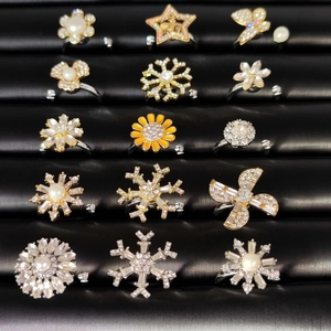 Detailed collection of adjustable rings featuring snowflake, star, and flower designs