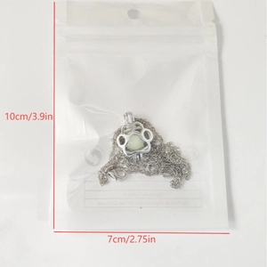 Luminous dog paw pendant necklace with dimension marking shown in packaging