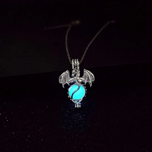 Luminous dragon necklace pendant glowing in the dark with a blue fluorescent bead