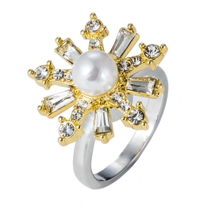 Detail of sunflower spinner ring with white pearl and sparkling zircon crystals