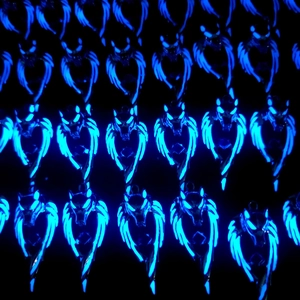 Luminous wolf head with wings pendants glowing blue on a black background