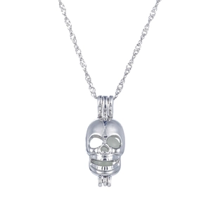 Luminous skull pendant necklace in silver finish with hollowed out 3D design on white background