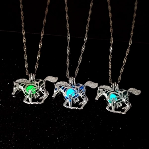 Luminous hollow horse pendant necklace with glowing green and blue stones on silver chain