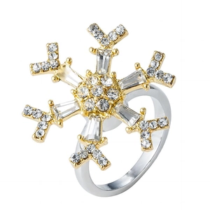 Elegant rotating snowflake ring with gold and silver tones and sparkling zircons