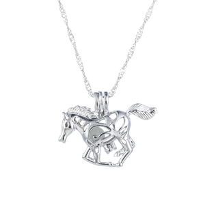 Detailed macro view of hollow horse pendant with glowing bead and silver twisted chain