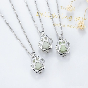 Halloween luminous dog paw pendant necklace with glowing green bead in silver cage