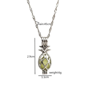 Luminous pineapple pendant necklace with silver hollow cage and glowing green bead