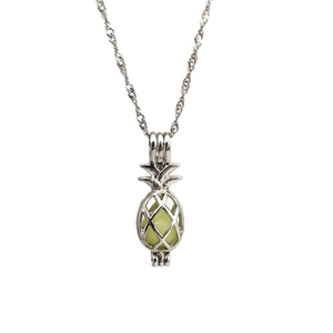 Luminous pineapple hollow cage pendant necklace with green glowing bead and silver chain