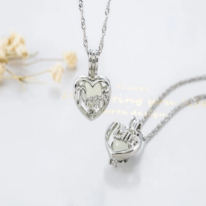 Luminous heart-shaped locket necklace with Mom script in silver finish