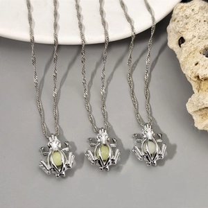 Luminous frog pendant necklace set with glowing beads on elegant silver chain