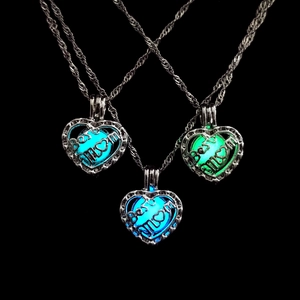 Luminous heart locket necklace for Mom showing three glow-in-the-dark colors