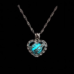 Macro detail of heart pendant with blue luminous bead and Best MOM engraving