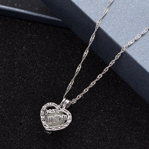 Luminous heart-shaped necklace with Best MOM engraving and light green bead on silver chain