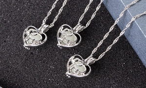 Close-up of elephant heart luminous necklace with glowing beads and silver plated frame