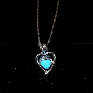 Luminous heart necklace with blue glowing stone and silver metal hollow pendant
