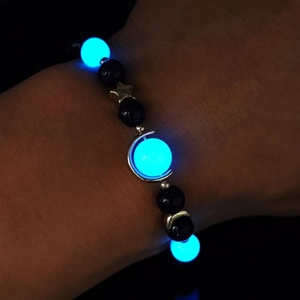 Glow-in-the-dark beaded bracelet with blue luminous beads, blue sandstone and star moon charms