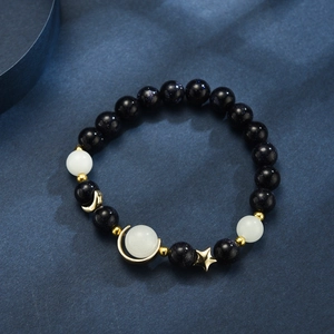 Star and moon glowing bracelet with blue sandstone and luminous crystal beads