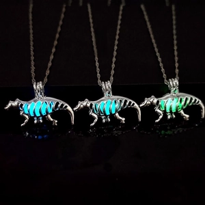 Luminous dinosaur skeleton pendant necklace in silver finish with glowing ribcage feature
