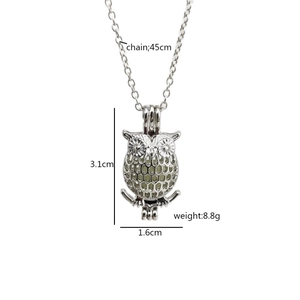Luminous owl pendant necklace in silver hollow design with light green glow-in-the-dark bead