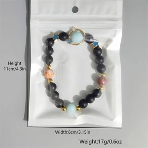 Detailed size chart of a matte star galaxy luminous beaded bracelet with Saturn charm