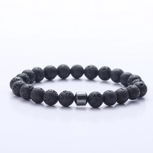 Detail of 8mm black lava stone beads with a smooth hematite cylinder on a men's bracelet