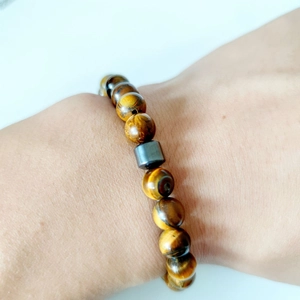 Tiger Eye stone beaded bracelet for men and women featuring a dark hematite charm bead