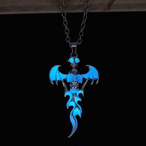 Gothic skull bat pendant necklace with luminous blue glow feature on dark background