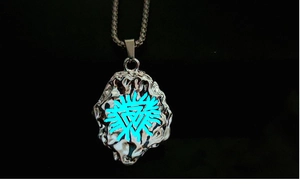 Macro shot of luminous blue Valknut symbol on a dark textured Viking pendant necklace
