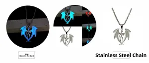 Detail of glow in the dark bat skull necklace with luminous blue effect and steel chain