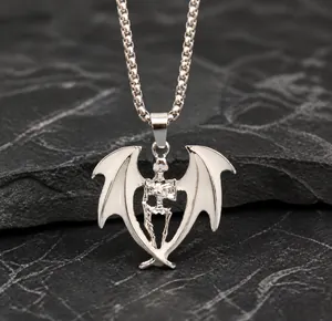 Macro shot of a punk skull pendant with bat wings on a silver metal chain