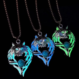 Luminous wolf head pendant necklace set with glowing turquoise in blue and green hues