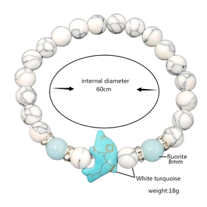 Luminous turquoise beaded bracelet with blue dolphin charm and white marble stone beads