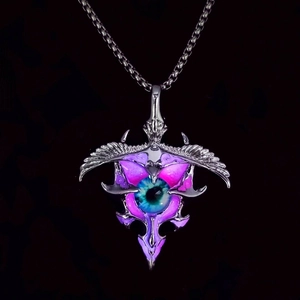 Macro detail of gothic eagle pendant featuring a realistic blue eye and glowing accents