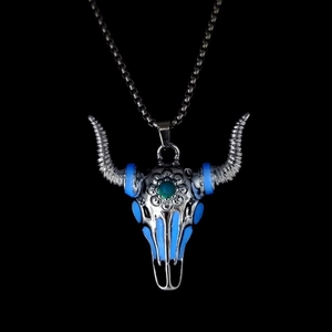 Vintage luminous bull skull pendant necklace with blue enamel and green stone detail